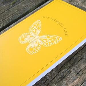 Elegant Yellow Journal with Butterfly Design